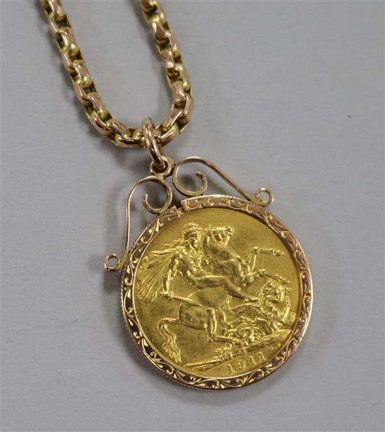 A 1911 gold full sovereign, in 9ct gold pendant mount and suspended from a 9ct gold chain.